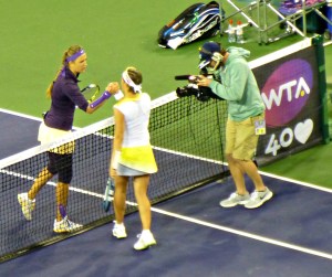 Victoria Azarenka shakes hands with Kirsten Flipkens of Belgium
