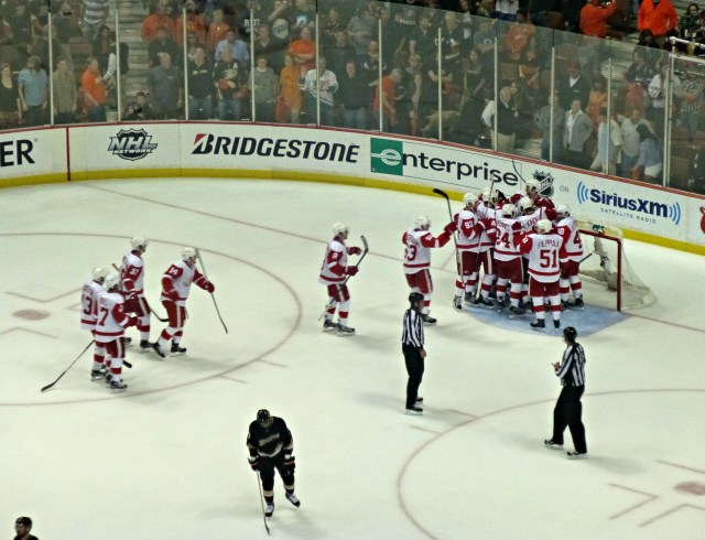 The Wings celebrate while the Ducks skate into the off-season with their tails between their legs