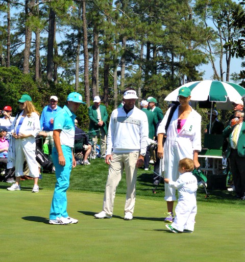 Bubba Watson with his Caddie Wife and kid while Ricky Fowler watches